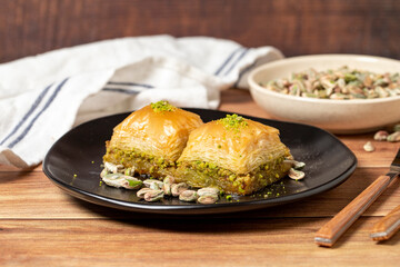 Pistachio baklava on wooden background. Turkish cuisine delicacies. Turkish baklava. close up