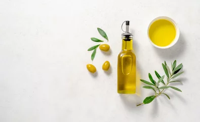 Schilderijen op glas Olives and olive oil in white bowl with bottle of olive oil on white background. Mockup for package. Copy space. © Tatyana Sidyukova