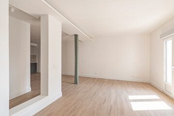 Empty room with large open space, old metal columns and minimalist design with smooth surfaces