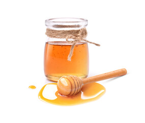 jar of honey with dipper
