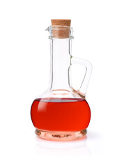 Red grape vinegar in glass decanter bottle isolated on white background with clipping path.