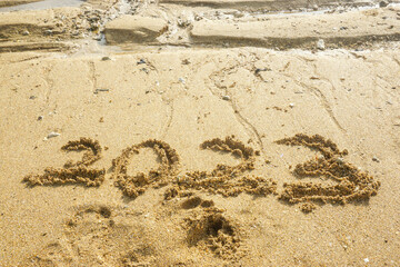 Sand writing for 2023 new year