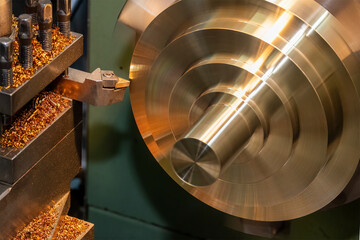 Closeup scene the lathe machine finish cut the brass parts by lathe tools.