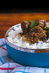 Sri Lankan style spicy chicken curry with white raw rice. Mouth watering, delicious Sri Lankan cuisine.