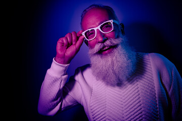 Photo of eccentric cheerful retired man have free time night club enjoy new year theme party isolated on dark gradient color background