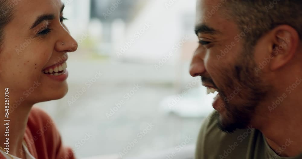 Sticker Couple, hug and kiss laughing with love in happy relationship, bonding and relax on living room sofa at home. Man and woman kissing with smile and laugh for fun loving happiness together on the couch