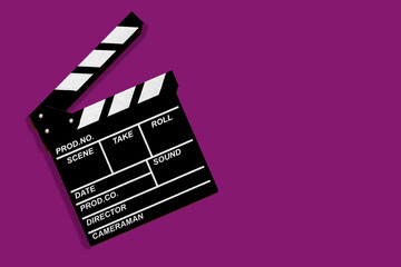 Movie clapperboard for shooting videos and movies on a purple background copy space