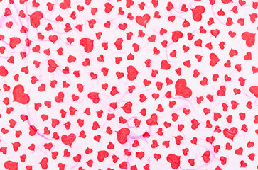 The Abstract blurred of red heart on white mulberry paper texture, suitable for a background. Valentine day.