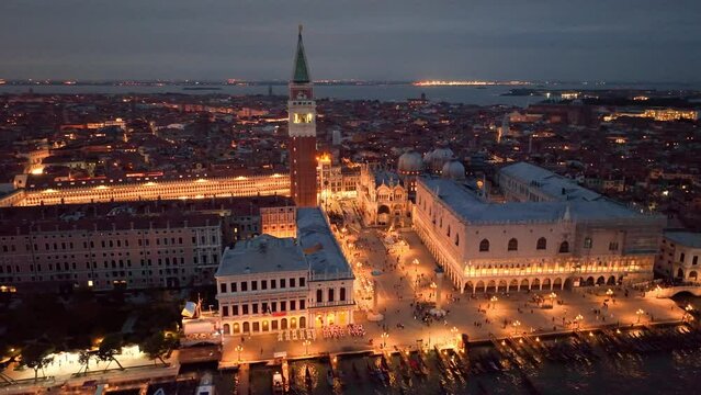 4K aerial drone view of Venice grand canal cathedral church in old town birds view. Venice italy skyline at sunset colored sky. Italy