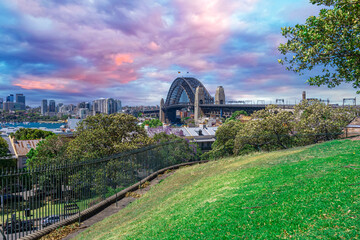 Sydney Harbour viewed from Observatory Park and overlooking Sydney Rocks area and North Sydney with colourful skies NSW Australia