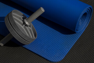 Exercise AB roller ab wheel and blue yoga mat on grey background Sport concept
