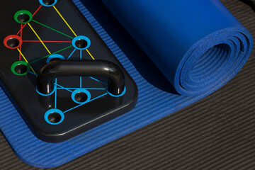 Push up board on blue yoga mat fitness concept