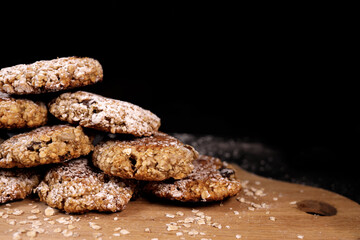Pyramid of oatmeal cookies on a black background