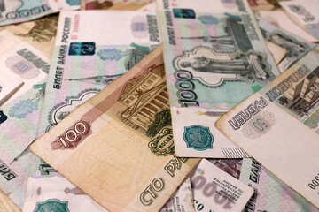 Fototapeta na wymiar Russian rubles banknotes background, texture. The concept of savings, investment, crisis