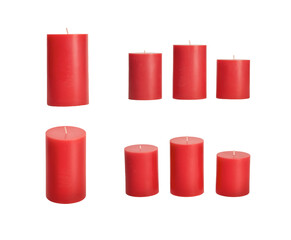 A selection of red wax candles for festive Christmas decorations isolated against a transparent...