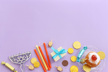 Religion image of jewish holiday Hanukkah background with menorah (traditional candelabra), doughnut and candles