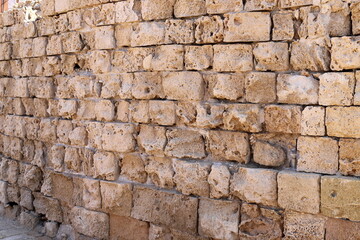 High wall made of stone and concrete.