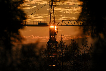 Energy from the sun - solar crane - Fire crane in the sunset