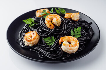 delicious black spaghetti pasta on a white background