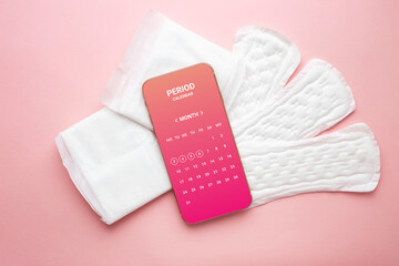 menstrual calendar app on phone isolated over pink background