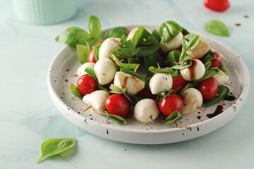 A plate with Italian salad caprese canape