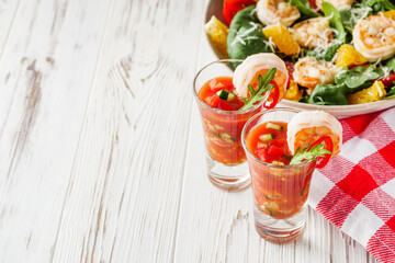 delicious summer gazpacho cocktail on a white wooden rustic background