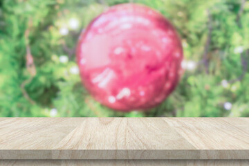 Empty wood table top with blur Christmas tree with bokeh light background