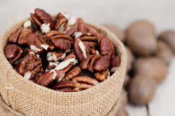 Close up of pecan nuts in brown sack 