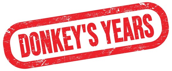 DONKEY'S YEARS, text written on red stamp sign.