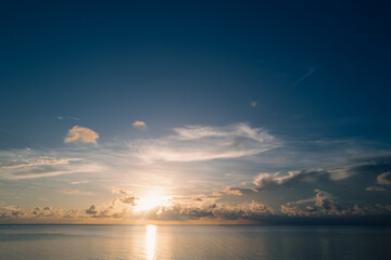 Fototapeta na wymiar Sunset on sea. Beach sunrise with cloudy sky. Caribbean sea.