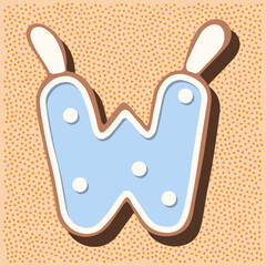 Christmas gingerbread in the shape of the letter with rabbit ears, white blue glaze, polka dots
