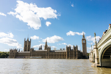 Fototapeta na wymiar The famous Big Ben and the English Parliament along the river Thames in London, England