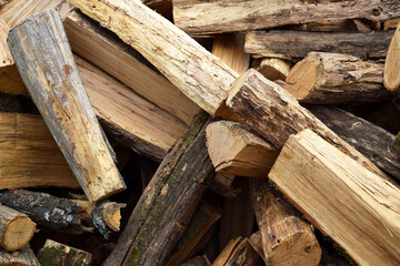 Lots of chopped oak firewood. Natural background.