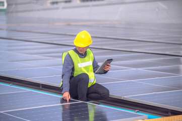 Engineer Hand checking solar power solar cell energy on rooftop of factory