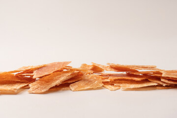 Group of tasty beer snacks. Dehydrated chicken meat slices.