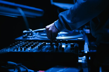 Hip hop dj mixing music on party in night club. Nightclub disc jockey plays set with sound mixer...