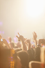 Bright concert background with happy music fans put hands up to favorite musician set