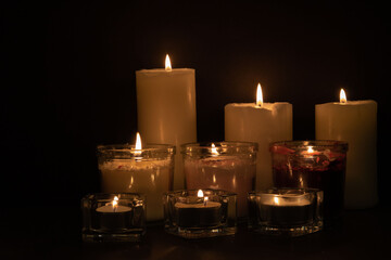 photo of lit candles in a row