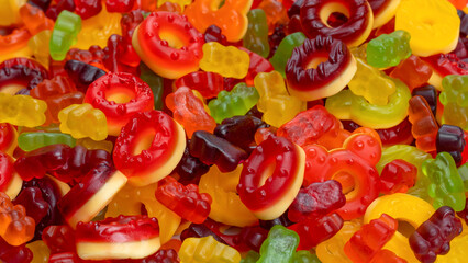 Assorted colorful gummy candies. Jelly donuts. Jelly bears.