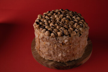 photo cake on a wooden board on a red background