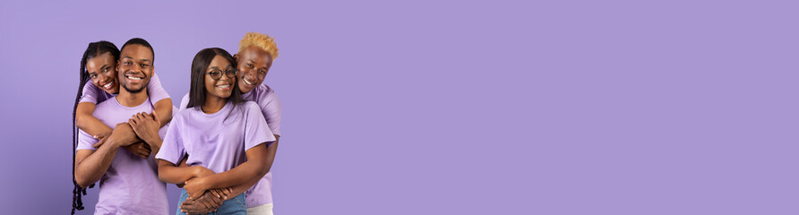 Loving african american couples posing on purple studio background