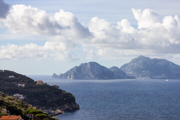 Residential Homes on Mountain by the Sea with Capri Island in background. Near Touristic Town of Sorrento, Italy.