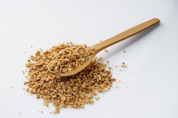 fresh raw buckwheat flakes on a white background
