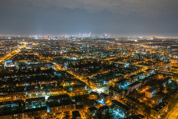 Fototapeta na wymiar Warsaw by night, aerial landscape of illuminated streets and buildings