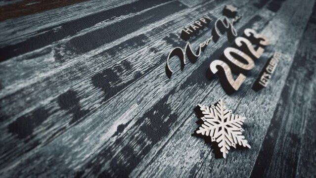 3D animation of 2023 Happy New Year glittering gold crome text on wood paper texture cinematic title. Ending cover for end scence trailer winter snow, Christmas and New year event background