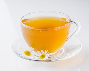 aromatic hot chamomile tea on a white background