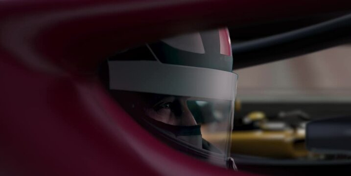 ECU Portrait of sports car driver in protective helmet racing on a speedway. Fast speed, motorsport