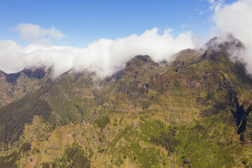 Drone view of mountains buried in clouds