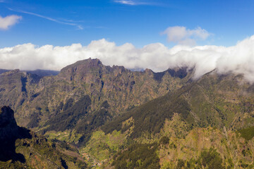 Drone view of mountains buried in clouds