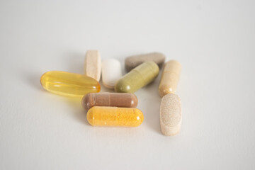 Pills vitamins on white background close up top view 